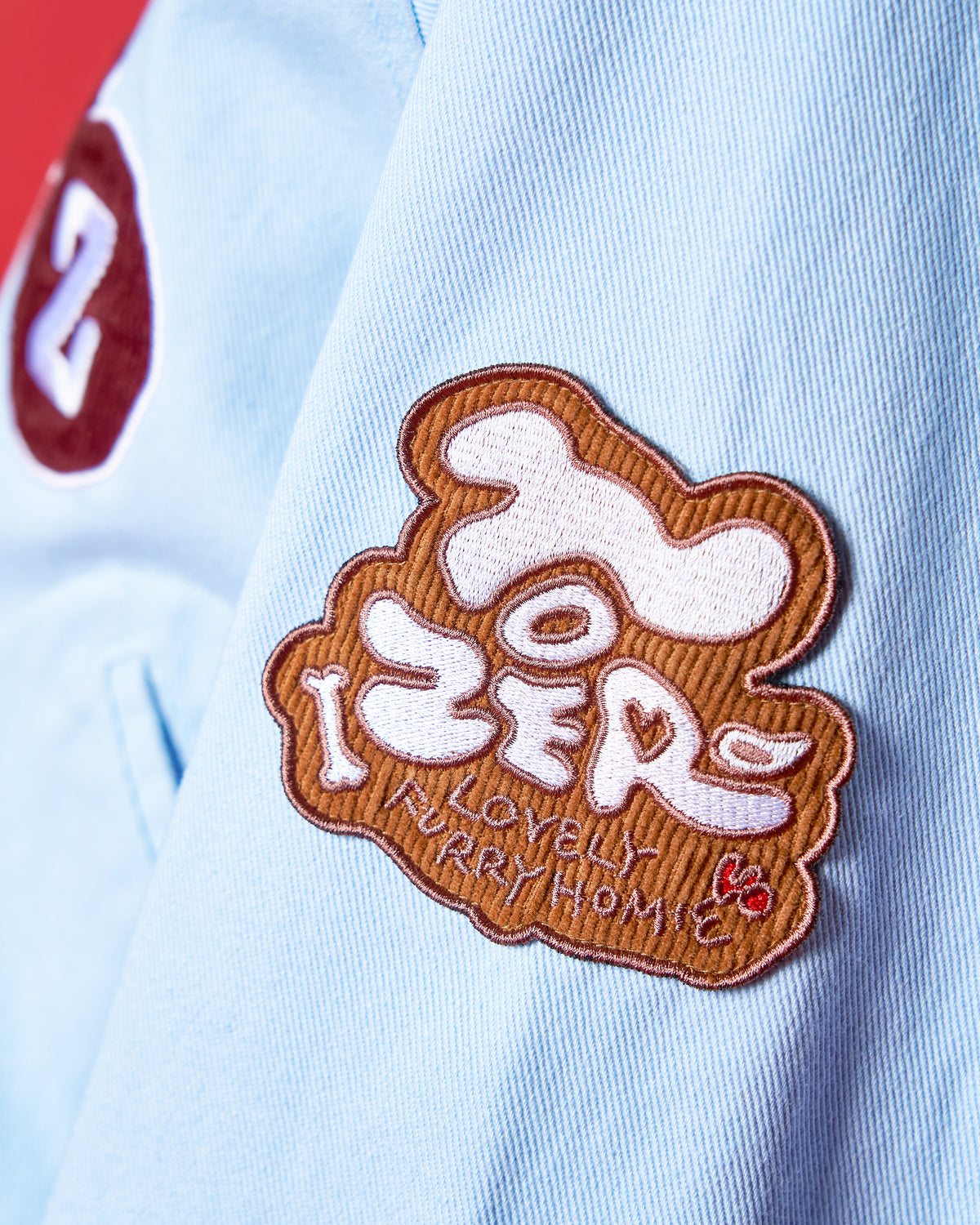 'LOVELY FURRY HOMIE' VARSITY JACKET (LIGHT BLUE)
